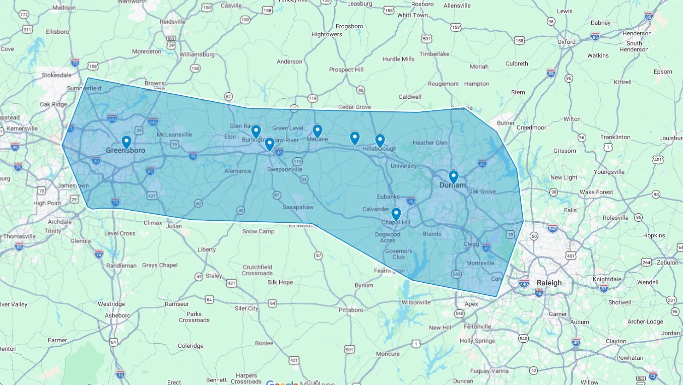 Map showing a blue coverage area with location markers overlaid on a road and geographical map background